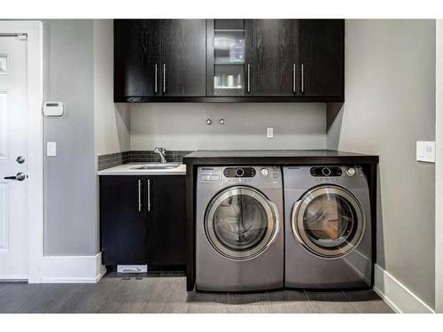 16 Spring Valley Way Sw, Calgary, AB - Indoor Photo Showing Laundry Room