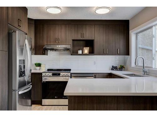 11 Millrose Place Sw, Calgary, AB - Indoor Photo Showing Kitchen With Double Sink With Upgraded Kitchen