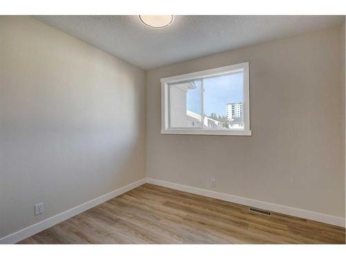 11 Millrose Place Sw, Calgary, AB - Indoor Photo Showing Other Room