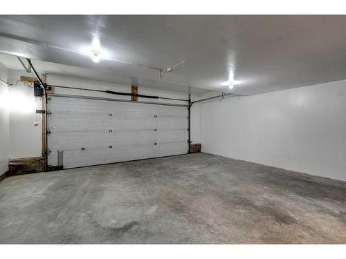 11 Millrose Place Sw, Calgary, AB - Indoor Photo Showing Garage