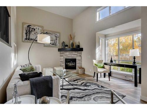 11 Millrose Place Sw, Calgary, AB - Indoor Photo Showing Living Room With Fireplace