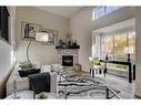 11 Millrose Place Sw, Calgary, AB  - Indoor Photo Showing Living Room With Fireplace 