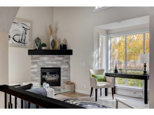 11 Millrose Place Sw, Calgary, AB - Indoor Photo Showing Living Room With Fireplace