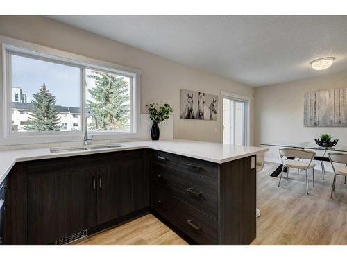 11 Millrose Place Sw, Calgary, AB - Indoor Photo Showing Kitchen With Double Sink