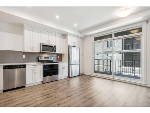 202-20 Sage Hill Nw, Calgary, AB - Indoor Photo Showing Kitchen With Stainless Steel Kitchen With Upgraded Kitchen