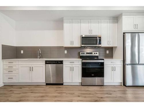 202-20 Sage Hill Nw, Calgary, AB - Indoor Photo Showing Kitchen With Stainless Steel Kitchen With Upgraded Kitchen