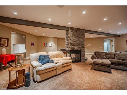 244122 Conrich Road, Rural Rocky View County, AB - Indoor Photo Showing Living Room With Fireplace