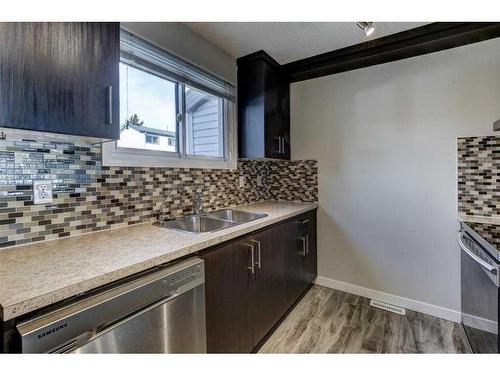 16-131 Templehill Drive Ne Drive Ne, Calgary, AB - Indoor Photo Showing Kitchen With Double Sink