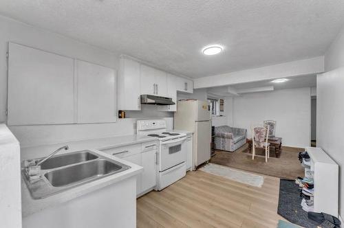 111 Martinwood Place Ne, Calgary, AB - Indoor Photo Showing Kitchen With Double Sink