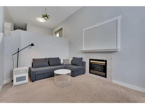 111 Martinwood Place Ne, Calgary, AB - Indoor Photo Showing Living Room With Fireplace