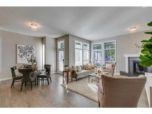 65 Discovery Ridge Road Sw, Calgary, AB - Indoor Photo Showing Living Room With Fireplace