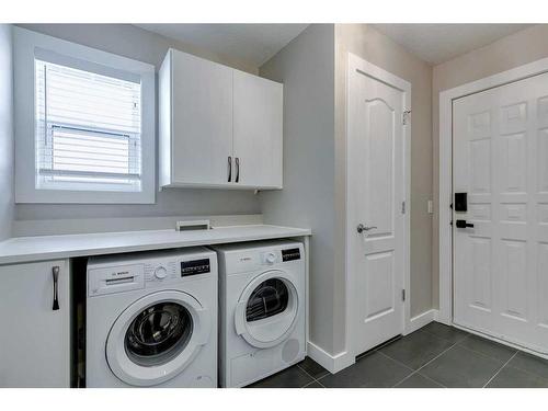 65 Discovery Ridge Road Sw, Calgary, AB - Indoor Photo Showing Laundry Room