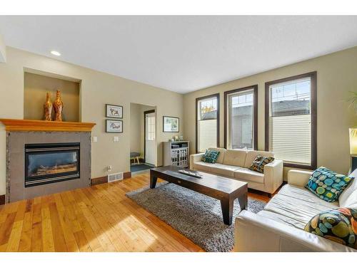 1311 21 Avenue Nw, Calgary, AB - Indoor Photo Showing Living Room With Fireplace