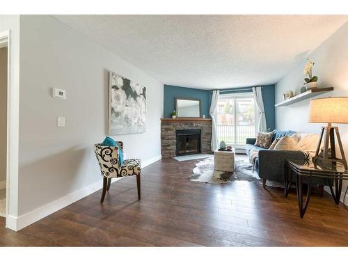 3101-13045 6 Street Sw, Calgary, AB - Indoor Photo Showing Living Room With Fireplace