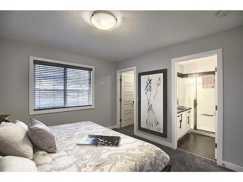 306 Sundown Road, Cochrane, AB - Indoor Photo Showing Bedroom