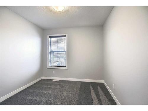 306 Sundown Road, Cochrane, AB - Indoor Photo Showing Other Room