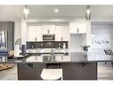 306 Sundown Road, Cochrane, AB  - Indoor Photo Showing Kitchen With Double Sink With Upgraded Kitchen 