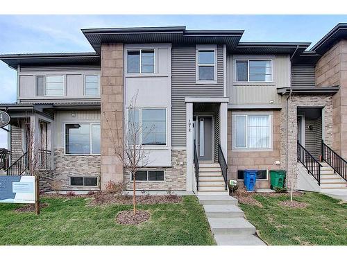 306 Sundown Road, Cochrane, AB - Outdoor With Facade