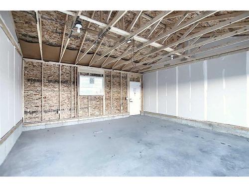 306 Sundown Road, Cochrane, AB - Indoor Photo Showing Garage