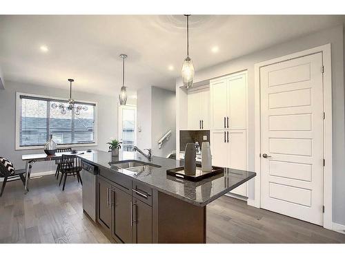 306 Sundown Road, Cochrane, AB - Indoor Photo Showing Kitchen With Double Sink With Upgraded Kitchen