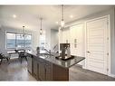 306 Sundown Road, Cochrane, AB  - Indoor Photo Showing Kitchen With Double Sink With Upgraded Kitchen 