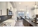 306 Sundown Road, Cochrane, AB  - Indoor Photo Showing Kitchen With Double Sink With Upgraded Kitchen 