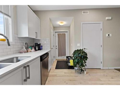 102-130 Redstone Walk Ne, Calgary, AB - Indoor Photo Showing Kitchen With Double Sink