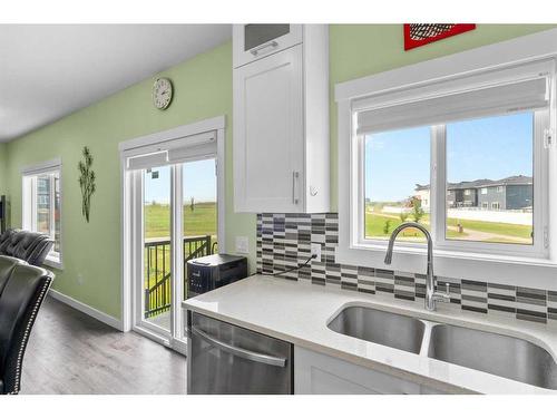 1412 Price Close, Carstairs, AB - Indoor Photo Showing Kitchen With Double Sink