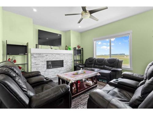 1412 Price Close, Carstairs, AB - Indoor Photo Showing Living Room With Fireplace