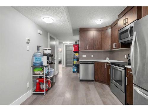 2002 38 Street Se, Calgary, AB - Indoor Photo Showing Kitchen With Stainless Steel Kitchen