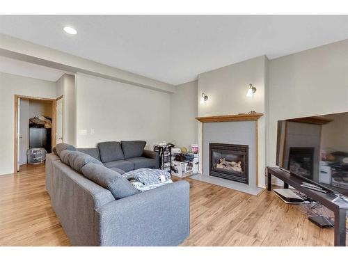 234 Mt Assiniboine Place Se, Calgary, AB - Indoor Photo Showing Living Room With Fireplace