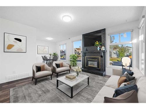 44 Aberfoyle Close Ne, Calgary, AB - Indoor Photo Showing Living Room With Fireplace