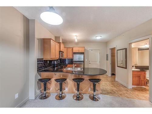 2609-11811 Lake Fraser Drive Se, Calgary, AB - Indoor Photo Showing Kitchen With Double Sink