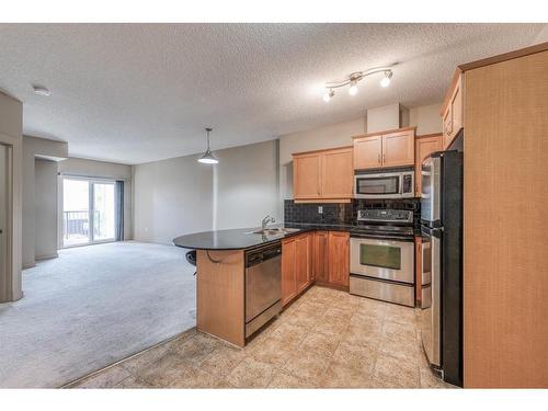 2609-11811 Lake Fraser Drive Se, Calgary, AB - Indoor Photo Showing Kitchen With Stainless Steel Kitchen