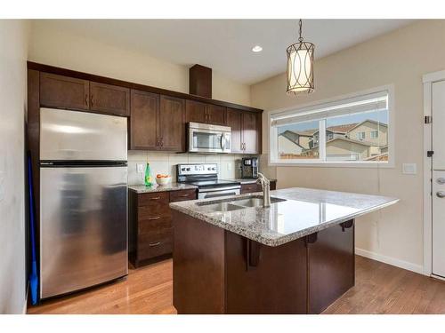 242 Cranford Way Se, Calgary, AB - Indoor Photo Showing Kitchen With Double Sink