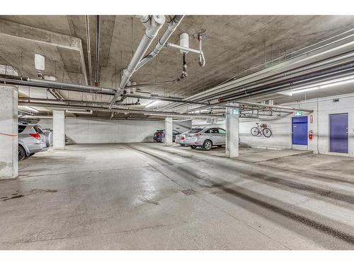 218-208 Holy Cross Sw, Calgary, AB - Indoor Photo Showing Garage