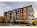 218-208 Holy Cross Sw, Calgary, AB  - Outdoor With Balcony With Facade 