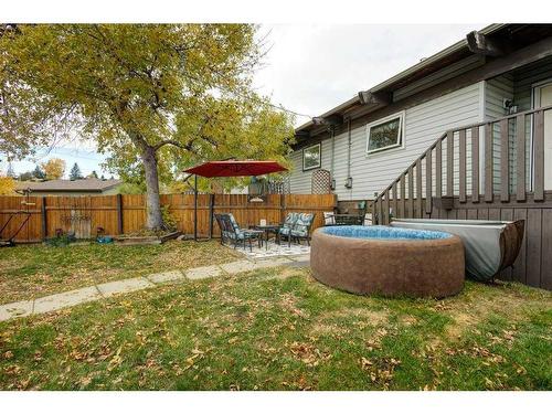 86A Queen Alexandra Close Se, Calgary, AB - Outdoor With Deck Patio Veranda With Backyard