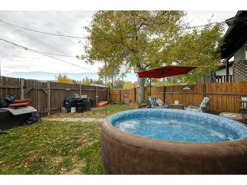 86A Queen Alexandra Close Se, Calgary, AB - Outdoor With Above Ground Pool With Backyard