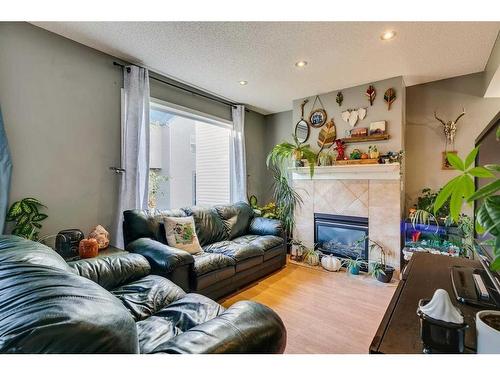 137 Bridlewood Lane Sw, Calgary, AB - Indoor Photo Showing Living Room With Fireplace