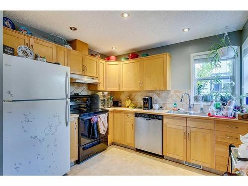 137 Bridlewood Lane Sw, Calgary, AB - Indoor Photo Showing Kitchen With Double Sink