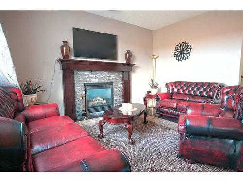 118 Everglen Crescent Sw, Calgary, AB - Indoor Photo Showing Living Room With Fireplace