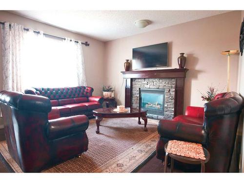 118 Everglen Crescent Sw, Calgary, AB - Indoor Photo Showing Living Room With Fireplace