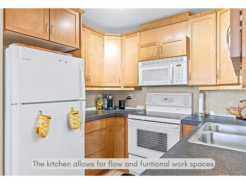 2-614 3Rd Street, Canmore, AB - Indoor Photo Showing Kitchen With Double Sink