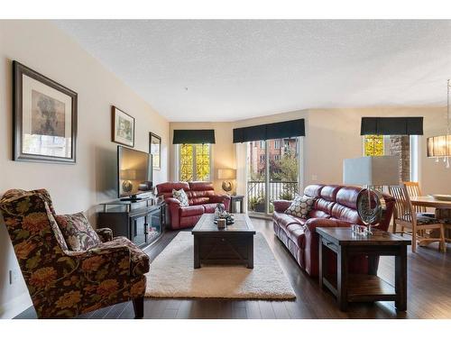 2110-15 Sunset Square, Cochrane, AB - Indoor Photo Showing Living Room