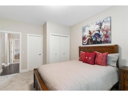 2110-15 Sunset Square, Cochrane, AB - Indoor Photo Showing Bedroom