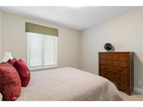 2110-15 Sunset Square, Cochrane, AB - Indoor Photo Showing Bedroom