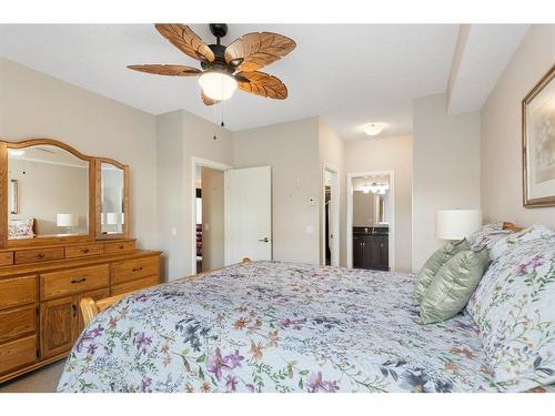 2110-15 Sunset Square, Cochrane, AB - Indoor Photo Showing Bedroom