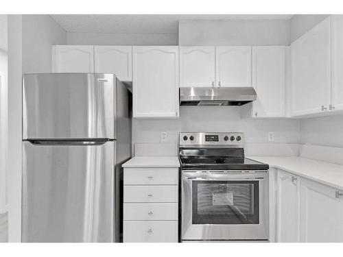 103-7 Somervale View Sw, Calgary, AB - Indoor Photo Showing Kitchen With Stainless Steel Kitchen