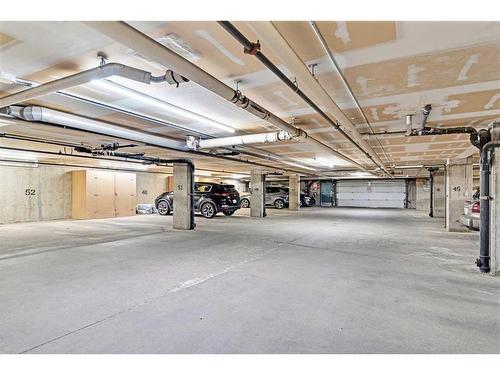 103-7 Somervale View Sw, Calgary, AB - Indoor Photo Showing Garage